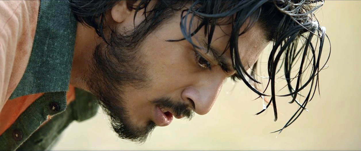 <p>A scene from 'Golondaaj' (2021) depicting an Indian football player sweating in field, while striving against their British opponents</p>


















